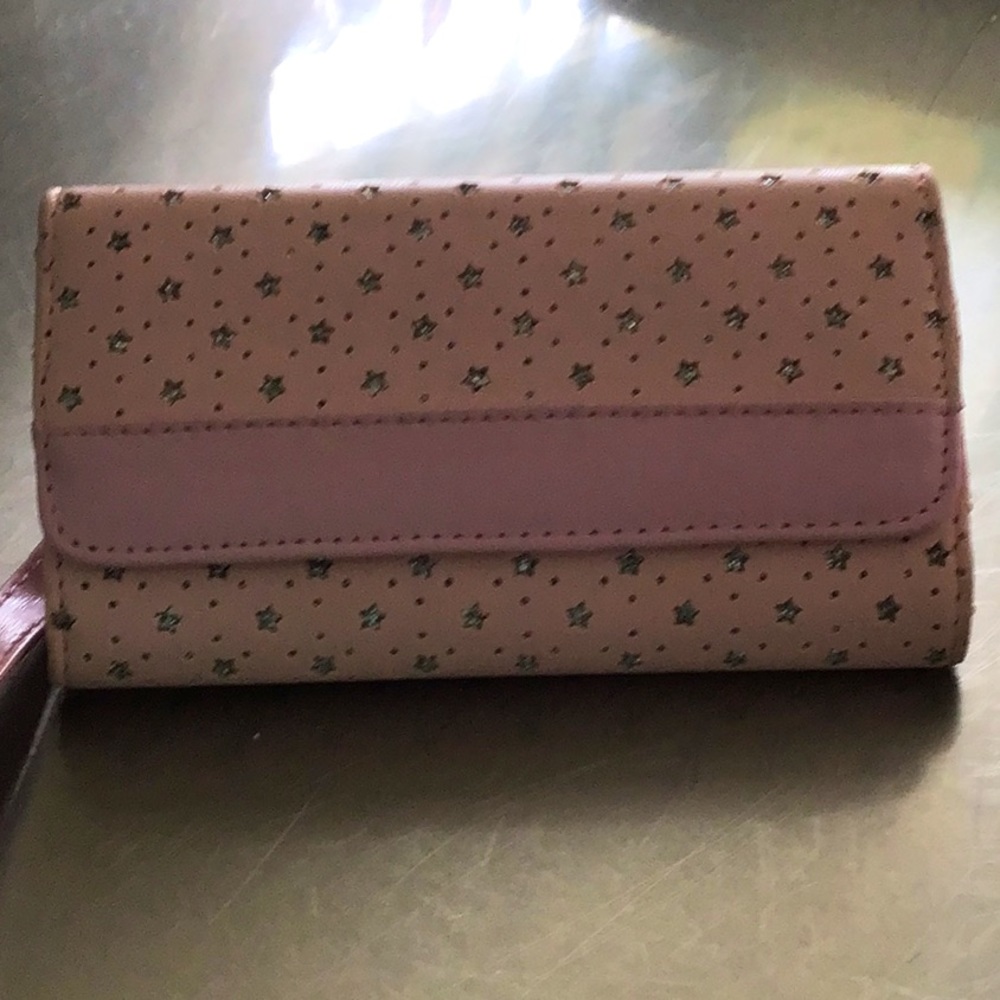 Small phone carrier, removable wristlet strap, clip on back.
